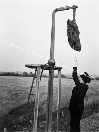 DANGLING MAILBAG WITH WORKER